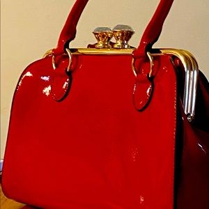 Beautiful stylish red handbag with shoulder strap